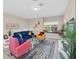 Comfortable living room featuring stylish furniture, including sofa, chairs, and a cozy ambiance at 2736 Oakwater Dr, Kissimmee, FL 34747