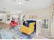 Bright living room featuring a sofa, chairs, and an open dining area with abundant natural light at 2736 Oakwater Dr, Kissimmee, FL 34747