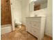 Bathroom with a white vanity and cabinet, neutral tile flooring, and modern fixtures at 2810 Elizabeth Ave, Orlando, FL 32804