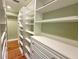 Walk-in closet with custom shelving and drawers, providing ample storage space and organization at 2810 Elizabeth Ave, Orlando, FL 32804