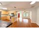 Open-concept kitchen with stainless steel appliances and hardwood floors at 2810 Elizabeth Ave, Orlando, FL 32804
