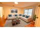 Spacious living room with ample seating, hardwood floors, and a large window with natural light at 2810 Elizabeth Ave, Orlando, FL 32804