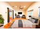 Bright main bedroom with hardwood floors, ceiling fan, and access to the backyard at 2810 Elizabeth Ave, Orlando, FL 32804