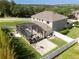 Aerial view of the house with a screened-in patio, pool, and basketball court at 2821 Columbus Ave, Clermont, FL 34715