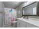 Bathroom featuring a vanity and unicorn-themed shower curtain at 2821 Columbus Ave, Clermont, FL 34715