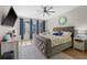Comfortable bedroom with a large bed, stylish rug, and lots of natural light from the windows at 2821 Columbus Ave, Clermont, FL 34715