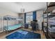 Comfortable bedroom with a bunk bed, desk, and a blue rug creating a cozy and functional space at 2821 Columbus Ave, Clermont, FL 34715