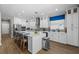 Modern kitchen featuring quartz countertops, stainless steel appliances and eat-in island at 2821 Columbus Ave, Clermont, FL 34715