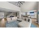 Spacious living area with high ceilings, open layout to kitchen, stairs, and lots of natural light at 2821 Columbus Ave, Clermont, FL 34715