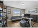 Functional office space with a desk, futon, shelving, and natural light at 2821 Columbus Ave, Clermont, FL 34715