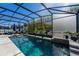 Sparkling pool in a screened enclosure, offering a private and refreshing outdoor experience at 2821 Columbus Ave, Clermont, FL 34715