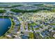 Aerial view of the community with lakes and residential houses at 2901 Harvest Hill Ln, Orlando, FL 32824