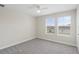 Bedroom featuring neutral carpet, ceiling fan, and sunny double windows at 2901 Harvest Hill Ln, Orlando, FL 32824
