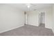 Bedroom featuring neutral carpet, closet, and doorway to walk-in closet at 2901 Harvest Hill Ln, Orlando, FL 32824