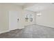 Spacious entryway featuring grey tile flooring, white walls, and a chandelier at 2901 Harvest Hill Ln, Orlando, FL 32824
