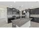 Kitchen island with granite countertops, stainless steel appliances, and stylish pendant lighting at 2901 Harvest Hill Ln, Orlando, FL 32824