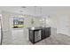 Kitchen island with granite countertops, stainless steel appliances, and stylish pendant lighting at 2901 Harvest Hill Ln, Orlando, FL 32824