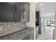Kitchen featuring dark wood cabinets, granite countertops and stainless appliances at 2901 Harvest Hill Ln, Orlando, FL 32824
