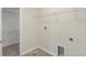 Laundry room with tile floor and washer/dryer hookups and wire shelf at 2901 Harvest Hill Ln, Orlando, FL 32824
