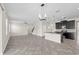 Open-concept with kitchen island, tile floors, stairs, and lots of natural light at 2901 Harvest Hill Ln, Orlando, FL 32824
