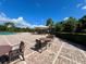 Community pool with tables and chairs for community members at 2901 Harvest Hill Ln, Orlando, FL 32824