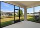 Spacious screened patio featuring black metal frames and views of the backyard at 2901 Harvest Hill Ln, Orlando, FL 32824