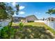 Expansive backyard featuring a screened-in pool area, offering a private outdoor retreat at 2902 Paddington Way, Kissimmee, FL 34747