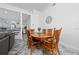 Cozy dining area adjacent to the kitchen and living room, perfect for Gathering meals at 2902 Paddington Way, Kissimmee, FL 34747