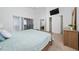 Airy main bedroom with a king size bed, vaulted ceiling, sliding glass doors, and a walk-in closet at 2902 Paddington Way, Kissimmee, FL 34747