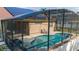 Screened-in pool and solar panels offer a sustainable and relaxing backyard retreat at 2902 Paddington Way, Kissimmee, FL 34747