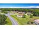 Aerial view showcasing neighborhood homes on spacious lots with mature tree coverage at 3110 Short Leaf Pine Ct, Kissimmee, FL 34746