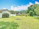 Spacious backyard featuring well-maintained grass, defined landscaping and partial fencing at 3110 Short Leaf Pine Ct, Kissimmee, FL 34746