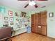 Bright bedroom featuring an organized craft area and a light green wall color at 3110 Short Leaf Pine Ct, Kissimmee, FL 34746