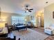 Inviting living room featuring wood-look floors, natural light, and neutral decor at 3110 Short Leaf Pine Ct, Kissimmee, FL 34746