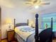 Comfortable bedroom with ceiling fan, wooden furniture and lamps with blue and white patterns at 3110 Short Leaf Pine Ct, Kissimmee, FL 34746