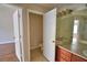 Bathroom featuring a double sink vanity, and a separate toilet room for privacy at 3151 Sinclair St # 104, Orlando, FL 32835