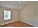 Bedroom featuring hardwood flooring and a window for natural light at 3151 Sinclair St # 104, Orlando, FL 32835