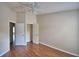 This bedroom boasts a ceiling fan, closet, and hardwood flooring at 3151 Sinclair St # 104, Orlando, FL 32835