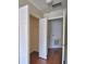 A bedroom closet featuring white bi-fold doors and a wooden floor at 3151 Sinclair St # 104, Orlando, FL 32835