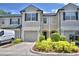 Charming townhome featuring a two-car garage and inviting landscaping at 3151 Sinclair St # 104, Orlando, FL 32835