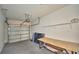 Spacious garage interior with an automatic door, offering ample room for vehicles and storage solutions at 3151 Sinclair St # 104, Orlando, FL 32835