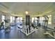 A community gym filled with exercise equipment, including treadmills, weights, and more at 3151 Sinclair St # 104, Orlando, FL 32835