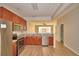 Modern kitchen with stainless steel appliances and a view into the living area at 3151 Sinclair St # 104, Orlando, FL 32835