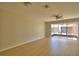 Spacious living room with wood flooring and natural light from sliding glass doors at 3151 Sinclair St # 104, Orlando, FL 32835