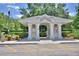 Community mail kiosk with covered area, parking, and attractive landscaping at 3151 Sinclair St # 104, Orlando, FL 32835