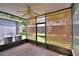 Enclosed patio with screened walls and ceiling fan offers a relaxing outdoor space at 3151 Sinclair St # 104, Orlando, FL 32835