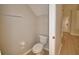 Practical powder room with toilet and towel rack at 3151 Sinclair St # 104, Orlando, FL 32835