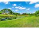 The backyard features pond, greenery, and grass lawn at 3170 Zaharias Dr, Orlando, FL 32837