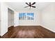 A bright bedroom with a ceiling fan and wood floors offers ample closet space at 3170 Zaharias Dr, Orlando, FL 32837