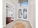 Bright foyer featuring tiled floors, high ceilings, decorative glass doors, and an open transition to the rest of the home at 3170 Zaharias Dr, Orlando, FL 32837